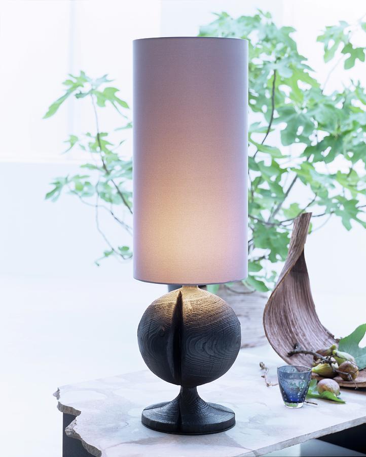 Table Lamp With Tall Cylindrical Lampshade And Spherical Base Photograph by Matteo Manduzio