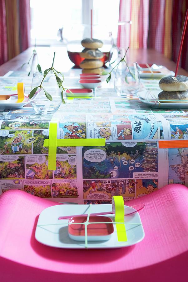 Table Set For Childs Birthday Party; Tablecloth Made From Asterix And Obelix Comic Pages And Washi Tape Photograph by Matteo Manduzio