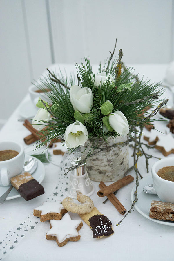 Table Set With Christmas Biscuits And Vase Of Hellebores For Afternoon Coffee Photograph by Martina Schindler