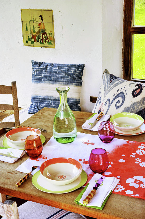 Table Set With Colourful Crockery Photograph by Christoph Theurer