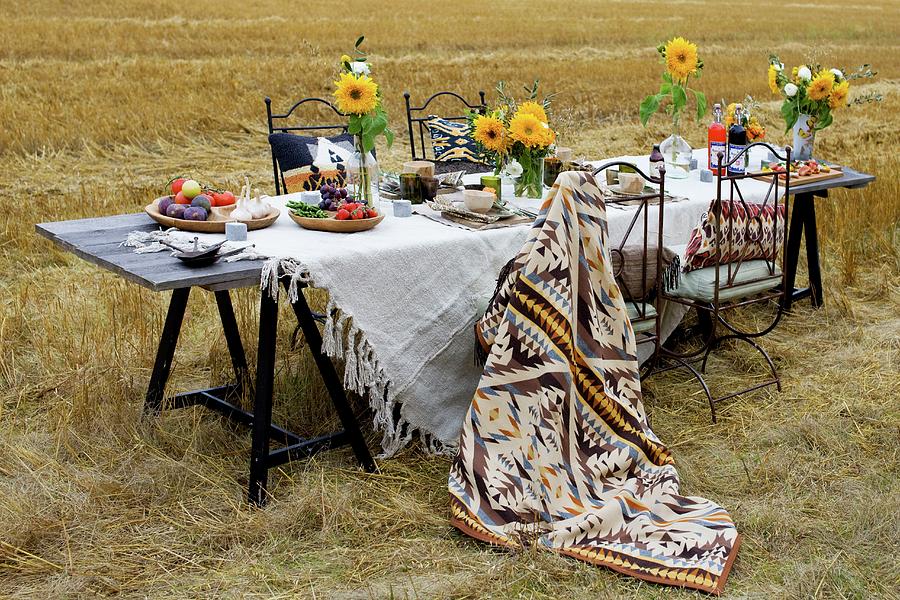 Table Set With White Linen Table Cloth And Yellow Sunflowers In Stubbly Field Photograph by Annette Nordstrom