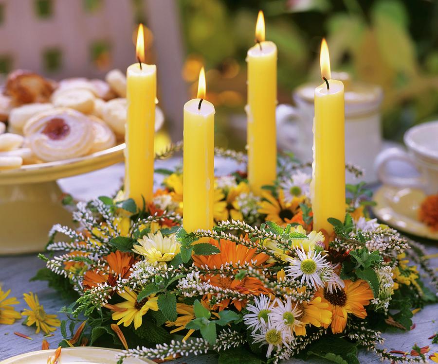 Table Wreath With Autumn Flowers And Candles Photograph by Friedrich Strauss