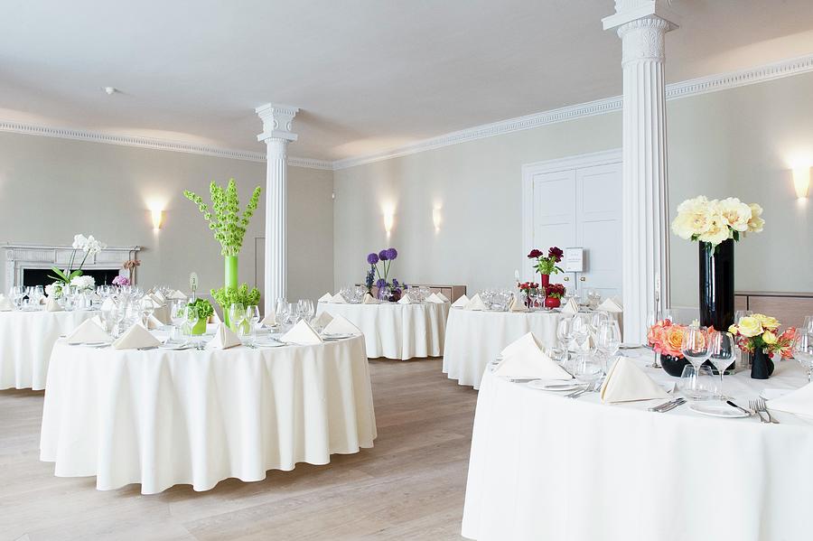 Tables Festively Set For Wedding In Room With White Columns Photograph by Jonathan Syer