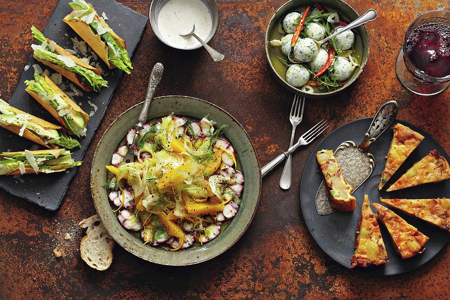 Tacos With Avocado, Romaine Lettuce And Parmesan, Octopus Carpaccio With Fennel And Orange Salad, Goats Cheese And Basil Pralines And Potato Tortilla With Chorizo, Tomatoes And Peas Photograph by Jalag / Mathias Neubauer