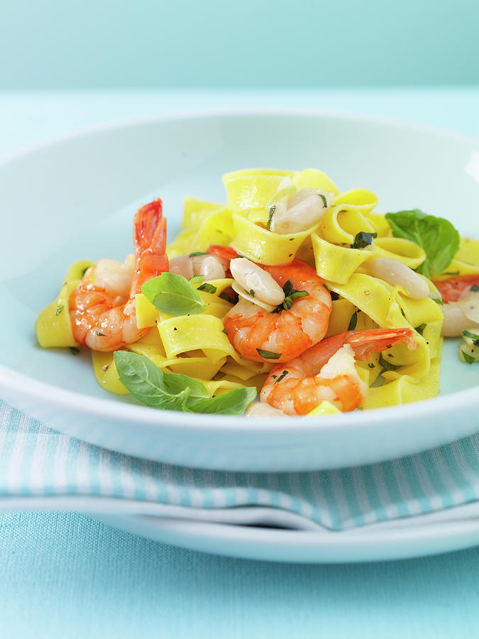 Tagliatelle Aglio Olio With Prawns And Beans Photograph by Andreas Thumm