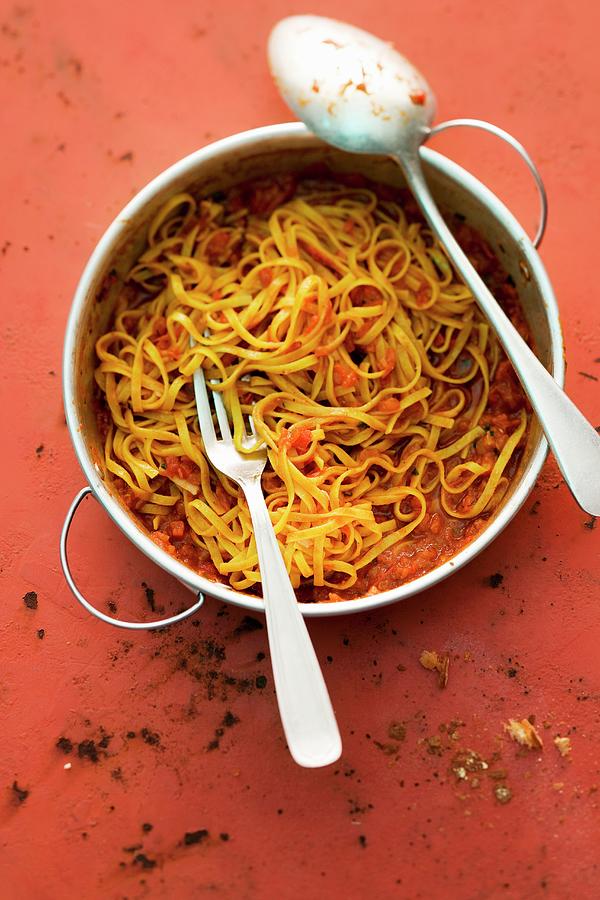 Tagliatelle With A Sweet And Spicy Tomato Sauce Photograph by Michael Wissing