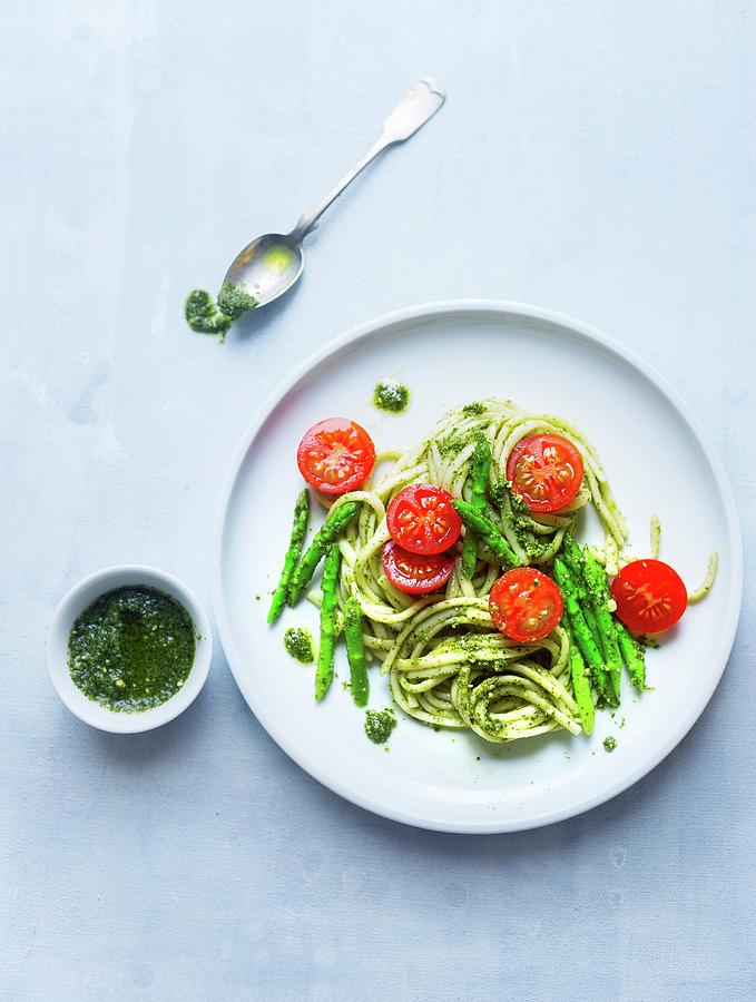 Tagliatelle With Green Asparagus, Pesto And Tomatoes Photograph by Ira Leoni