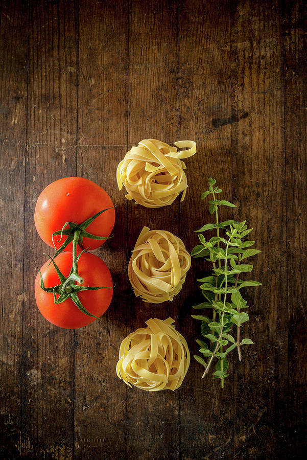 Tagliatelle With Vine Ripe Tomatoes And Oregano Photograph by Nitin Kapoor