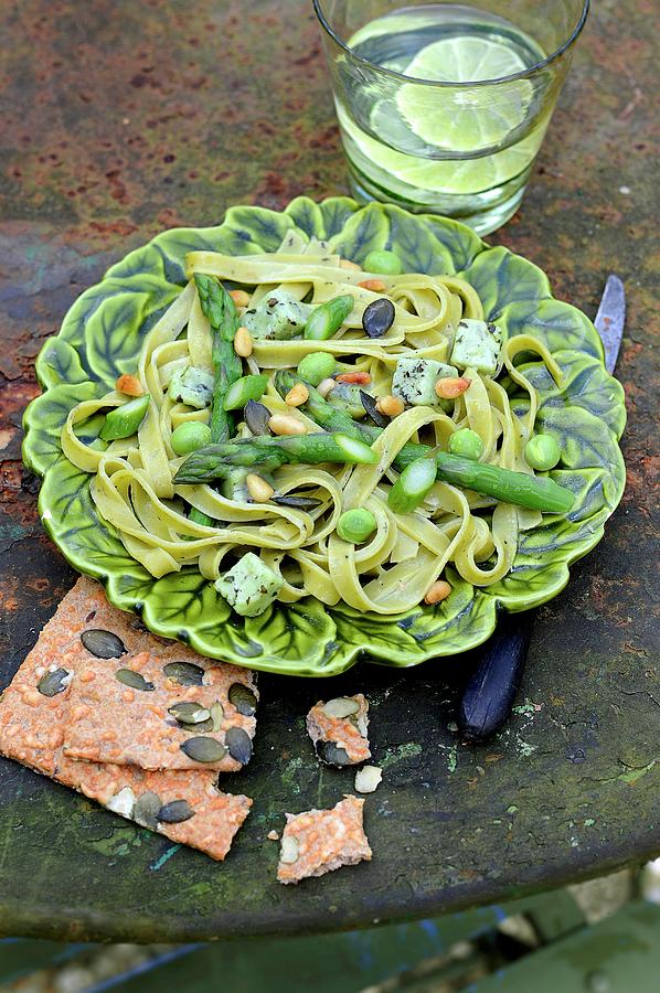 Tagliatelles With Green Asparagus, Broad Beans, , Cheese And Herbs, Squash Seed Crackers Photograph by Keroudan
