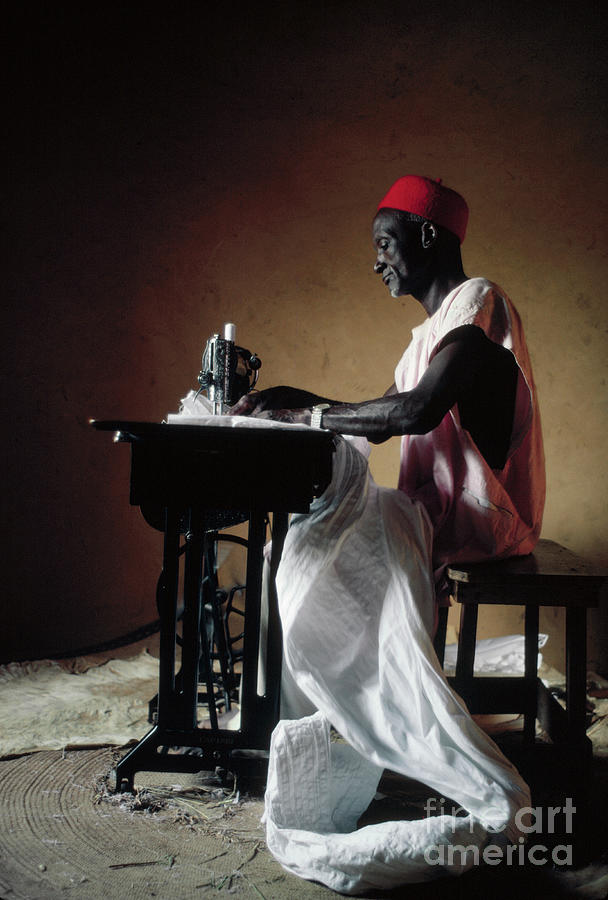 Tailor Using A Sewing Machine Photograph by Lawrence Manning