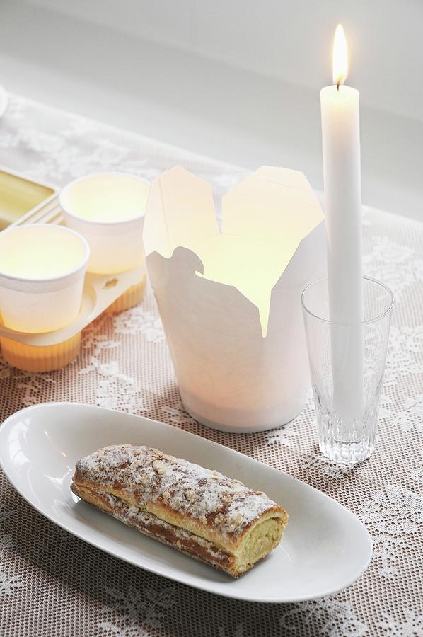 Take-away Carton, Tealights In Paper Cups, Lit Candle In Glass And Swiss Roll Photograph by James Stokes