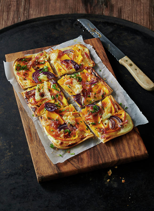 Tarte Flamb With Pumpkin And Red Onions On Wooden Board Photograph by Stefan Schulte-ladbeck