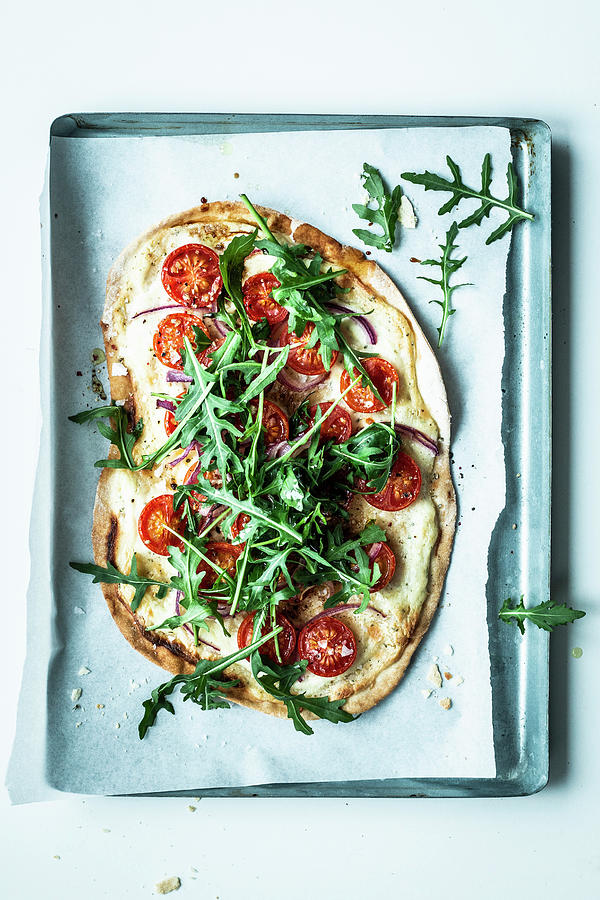 Tarte Flambe With Sour Cream, Tomatoes And Rocket Photograph by Simone Neufing