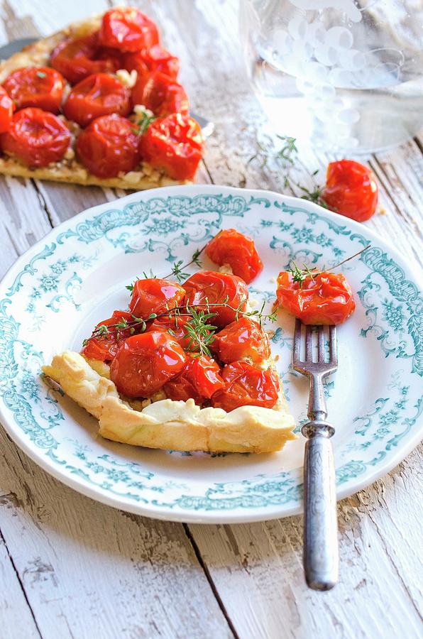 Tarte Tatin With Tomatoes And Thyme Photograph by Aniko Szabo