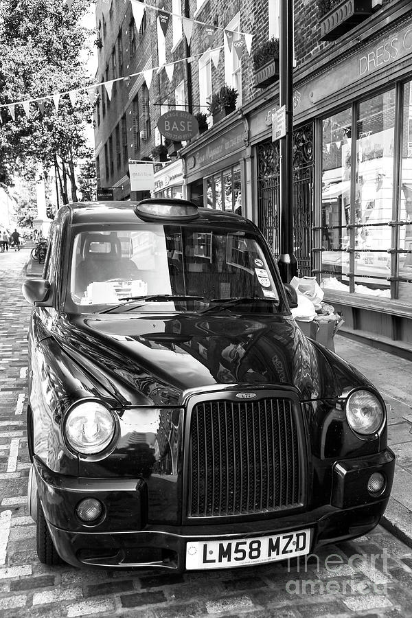Taxi in the West End of London Photograph by John Rizzuto