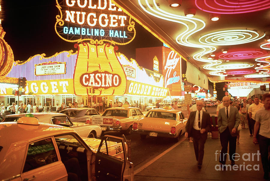Las Vegas Photograph - Taxis And Pedestrians On Las Vegas by Bettmann