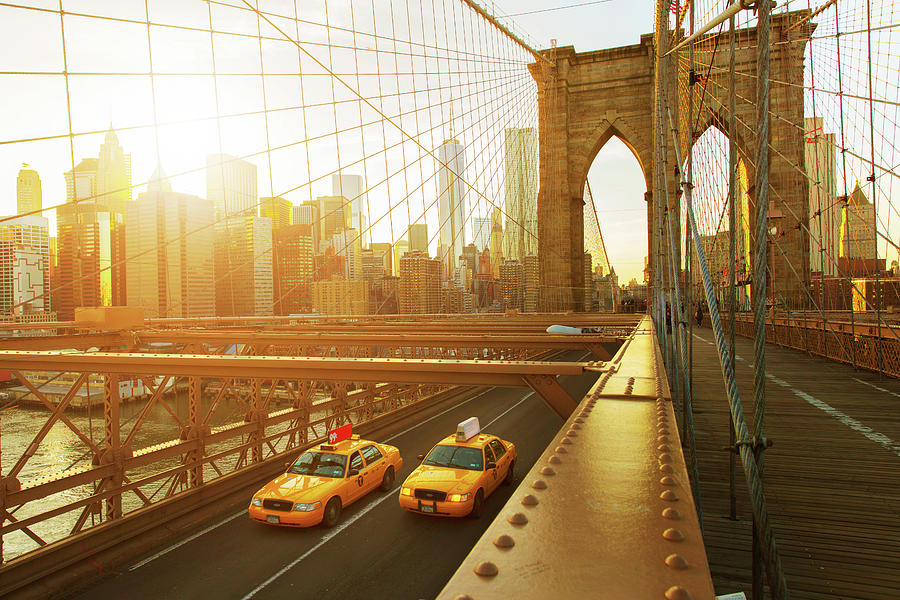 Taxis On The Brooklyn Bridge At Sunset Photograph by Tim Robberts