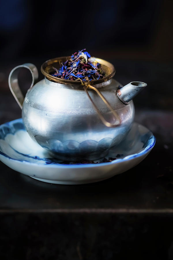 Tea Kettle With A Tea Strainer And Tea Leaves Photograph by Eising Studio