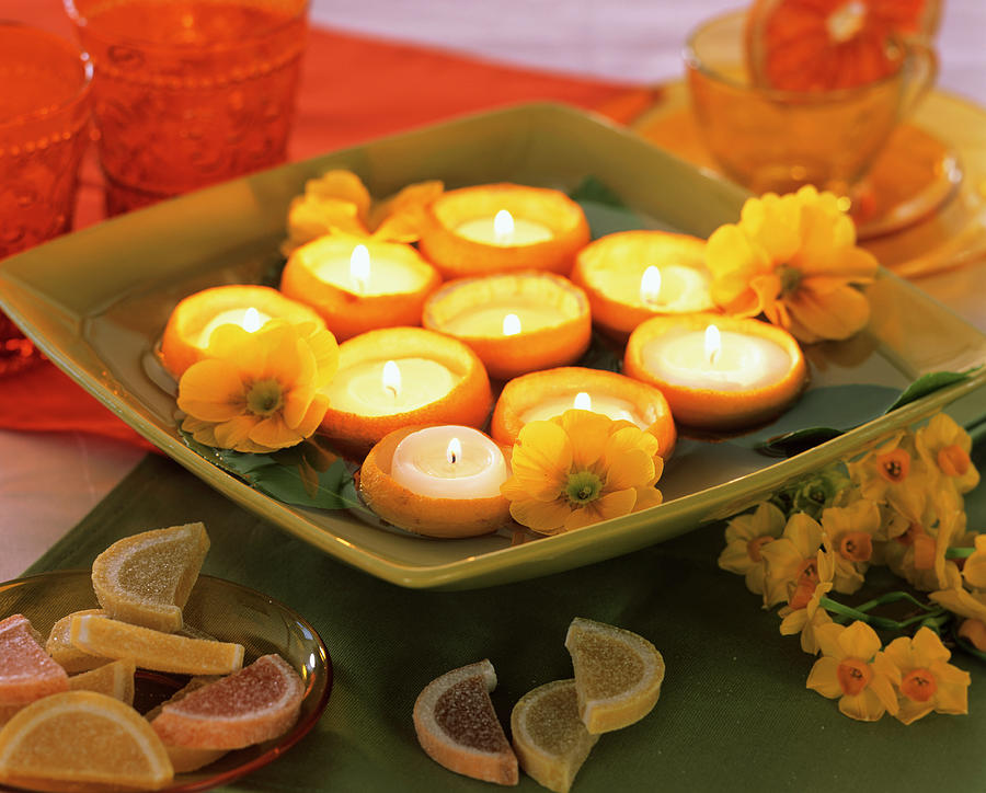 Tea Lights In Hollowed-out Lemon Halves Photograph by Friedrich Strauss