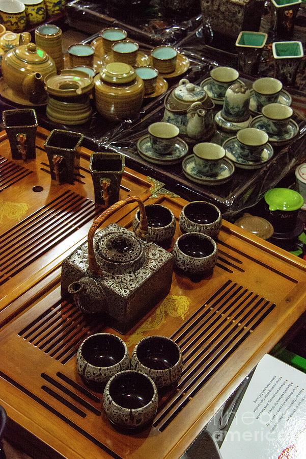 Tea Sets in Hanoi Night Market Photograph by Bob Phillips