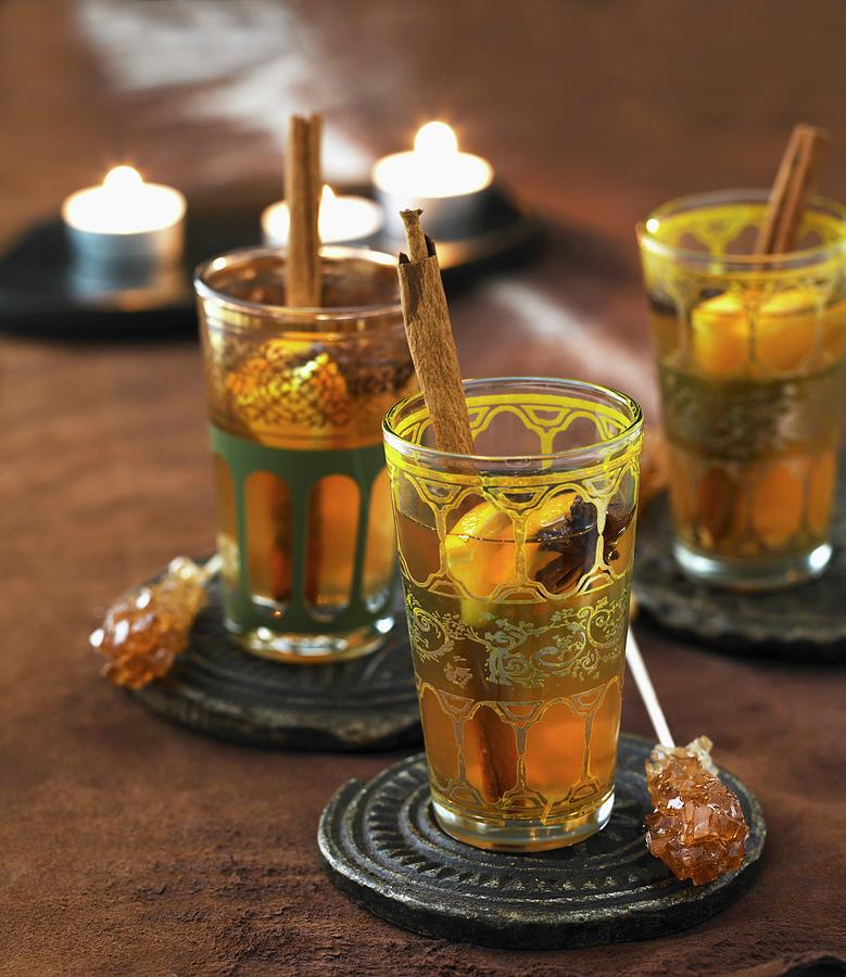 Tea With Spices And Rock Candy Sticks Photograph by Mikkel Adsbl