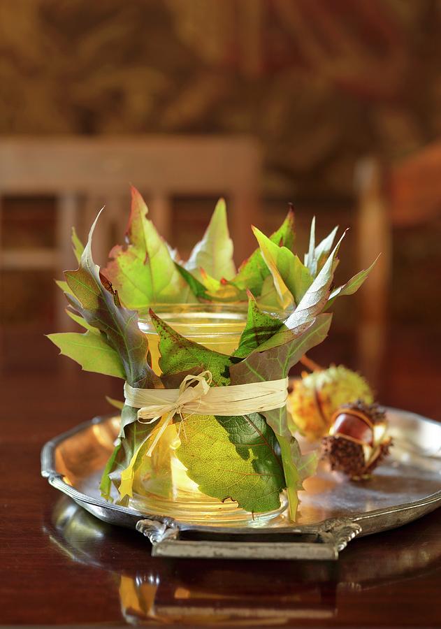 Tealight Holder Wrapped In Leaves Photograph by Peter Garten
