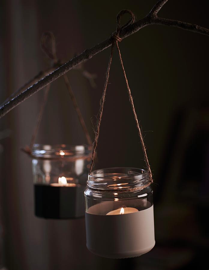 Tealight Holders Made From Small, Half-painted Jam Jars Tied To Branch With String Photograph by Andrew Boyd