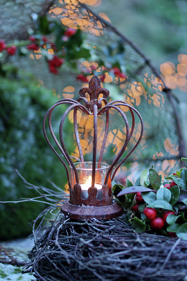 Tealight In Rusty Decorative Crown On Top Of Wreath On Table Outside Photograph by Angelica Linnhoff