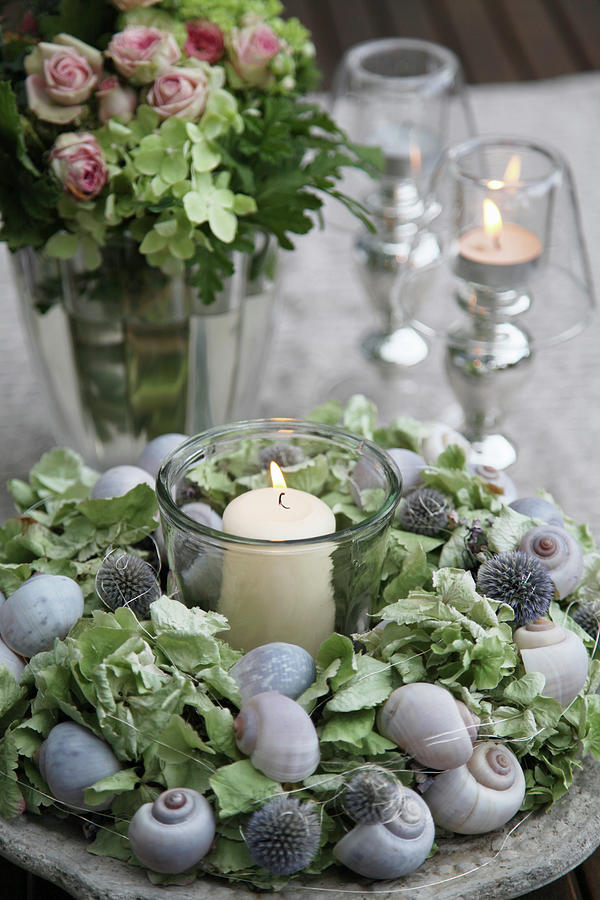 Tealight In Wreath Of Globe Thistles, Hydrangeas And Snail Shells Photograph by Sonja Zelano