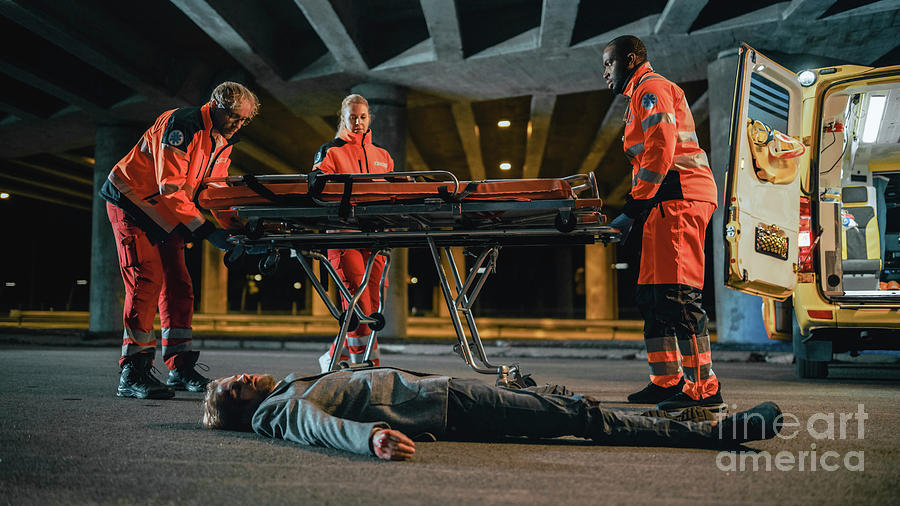 Team Of Paramedics Take Out A Stretcher From Ambulance Photograph by Gorodenkoff Productions/science Photo Library