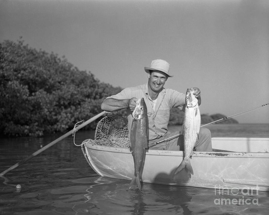 Ted Williams Holding Fish In Boat Photograph by Bettmann