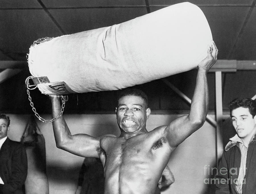 Teddy Davis Holding A Punching Bag Photograph by Bettmann