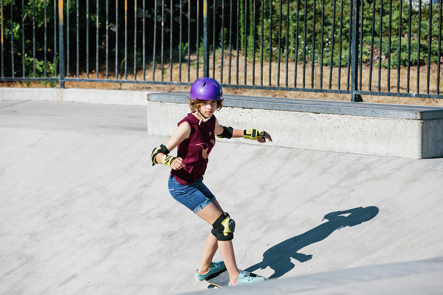 Teen Girl Focused As She Is Skateboarding At The Skatepark Photograph ...