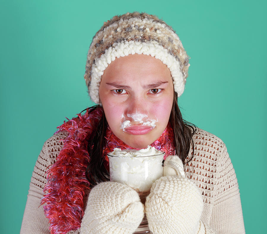 Teen girl in studio with cup of hot chocolate and winter clothes  Signed Release on file Photograph by Kyle Lee