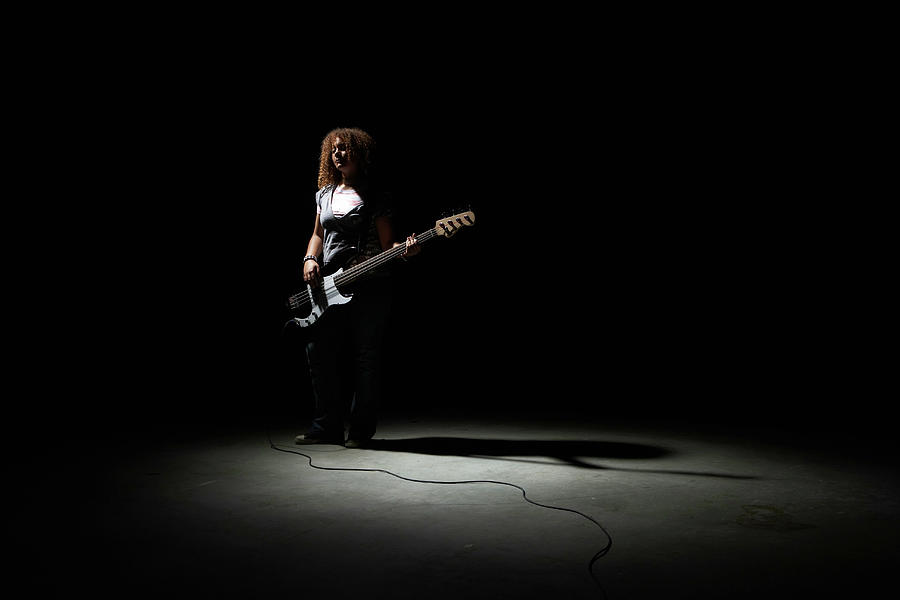 Teenage Girl 13-15 Playing Bass Guitar Photograph by Thomas Northcut