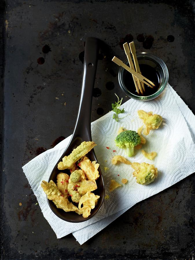 Tempura On A Spoon And On Kitchen Paper Photograph by Klaus Arras