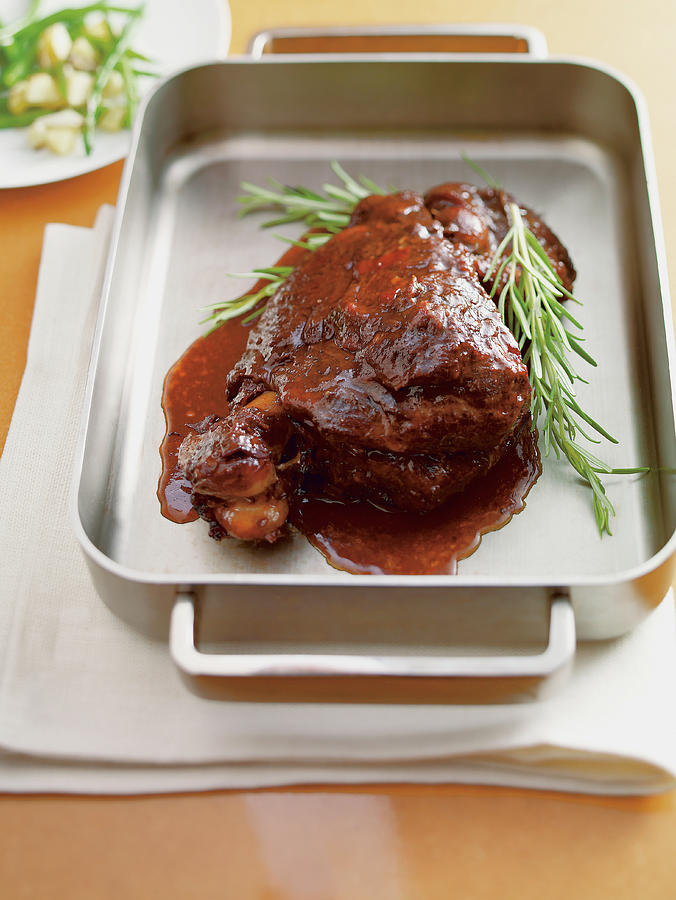 Tender Cooked Lamb With Red Wine, Dried Apricots And Rosemary Photograph by Tre Torri