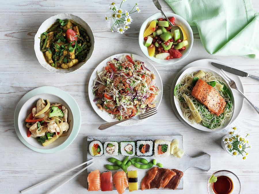 Teriyaki Salmon, Vietnamese Salad, Sushi, Two Chicken Dishes And A Fruit Salad Photograph by Jonathan Gregson