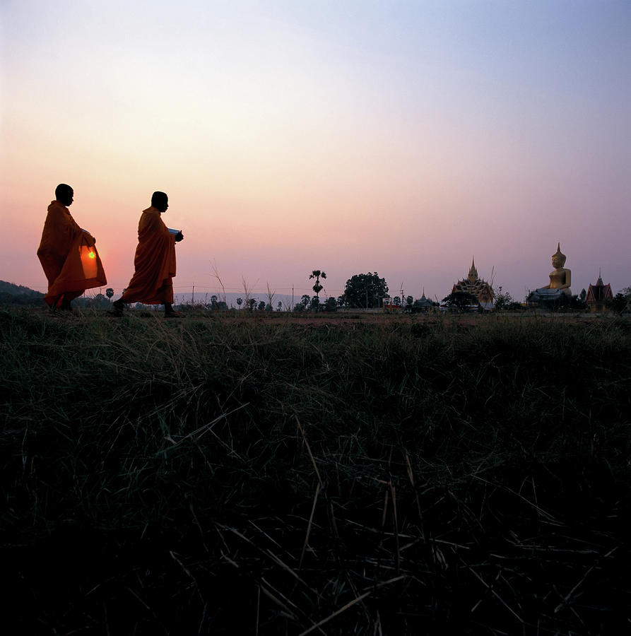 Thai Monks Returning To Their Temple Photograph by Enviromantic