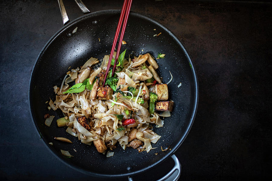 Thai Noodles With Chicken And Broccoli In A Wok Photograph by Eising Studio