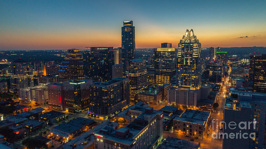 Austin Skyline Photograph - The Austin skyline shines at night in this scenic view of the booming downtown growth by Dan Herron