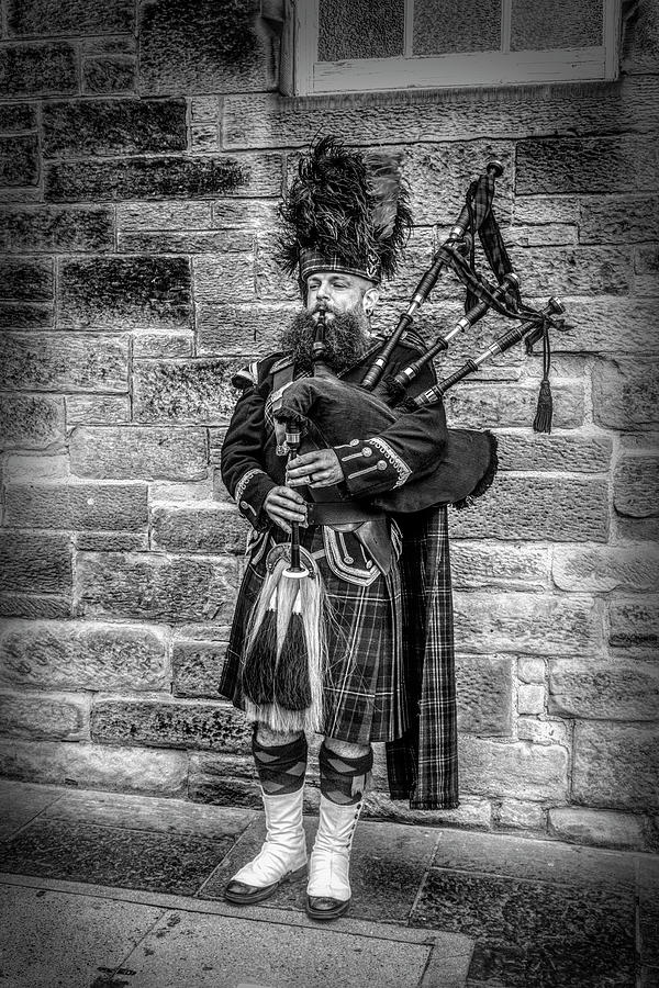 The Bagpiper In Full Dress in Black and White Photograph by Debra and Dave Vanderlaan