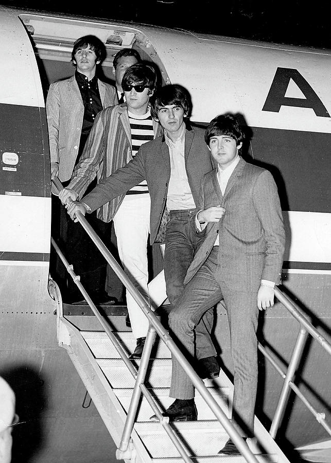 The Beatles Photograph - The Beatles Arriving by Globe Photos