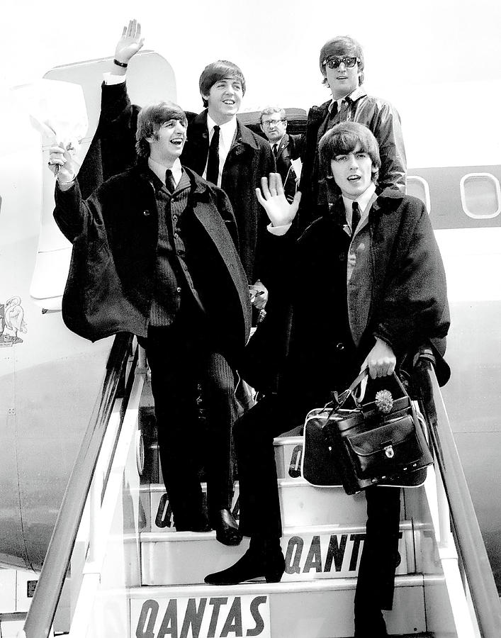 John Lennon Photograph - The Beatles Arriving In London by Globe Photos
