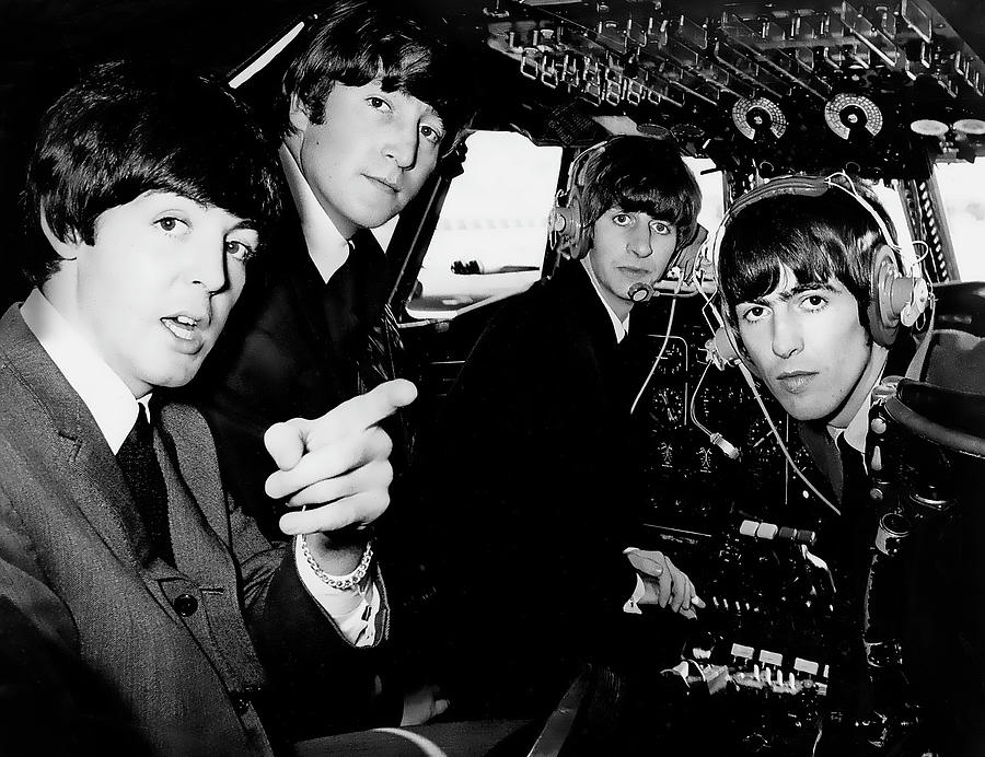 George Harrison Photograph - The Beatles In A Cockpit by Globe Photos
