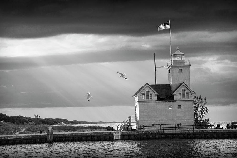 The Big Red Lighthouse in Black and White with Sunbeams on Lake  Photograph by Randall Nyhof