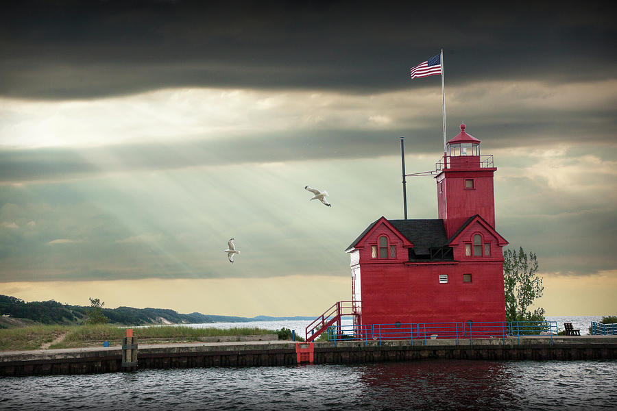 The Big Red Lighthouse with Sunbeams on Lake Michigan by Ottawa  Photograph by Randall Nyhof