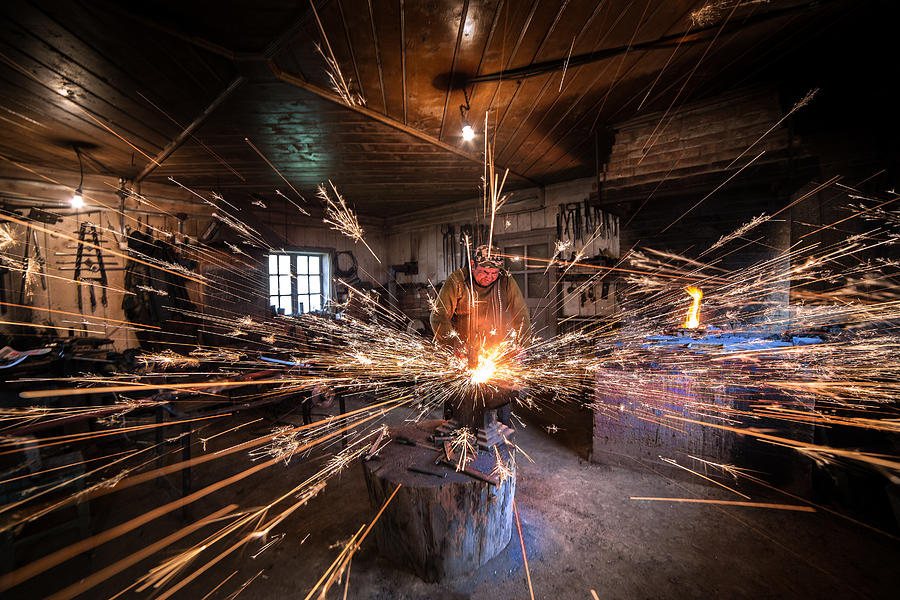 Blacksmith Photograph - The Blacksmith by Radu Dumitrescu