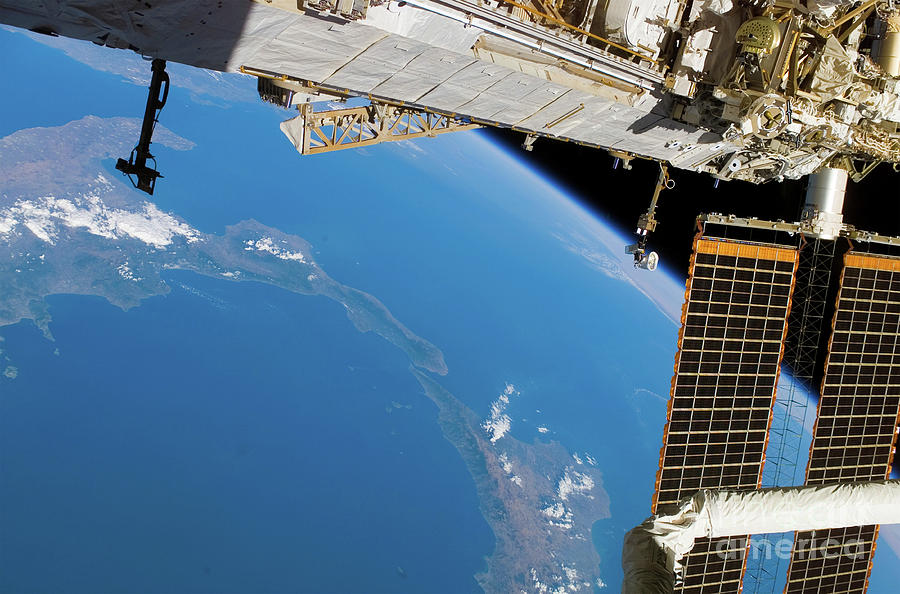 The boot of Italy and Sicily along with the International Space Station