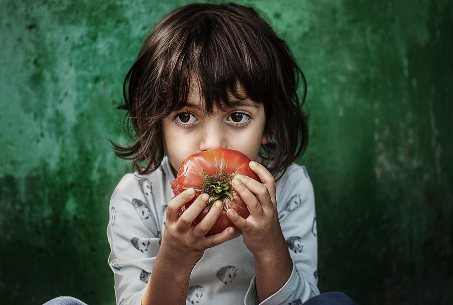 Tomato Photograph - The Child With Tomato by Magdalena - Carmen Zatari